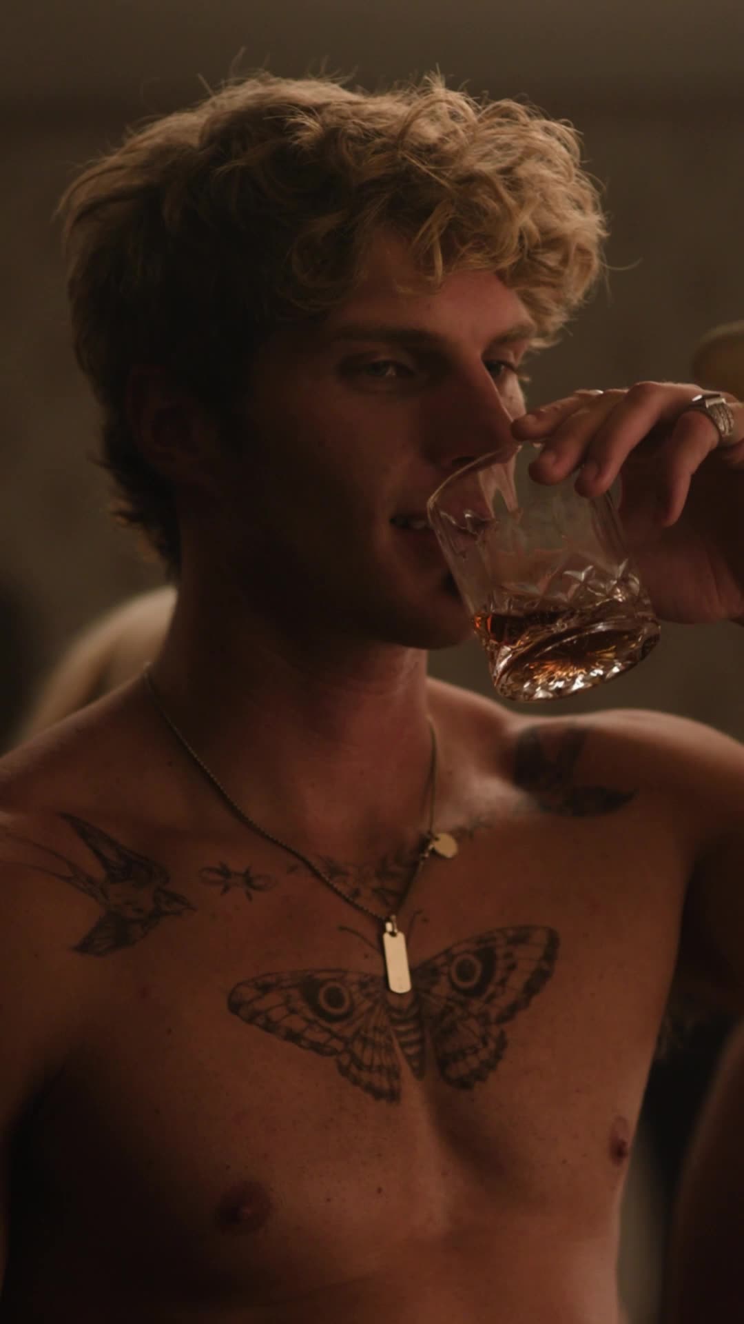 Country Heartthrob — male lead with tattoos, drinking whiskey